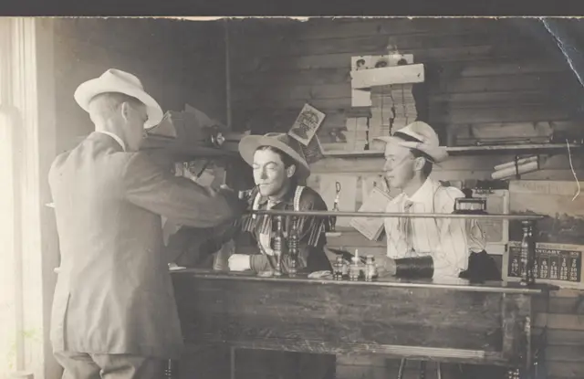 Three men at a counter in a Kelliher office
